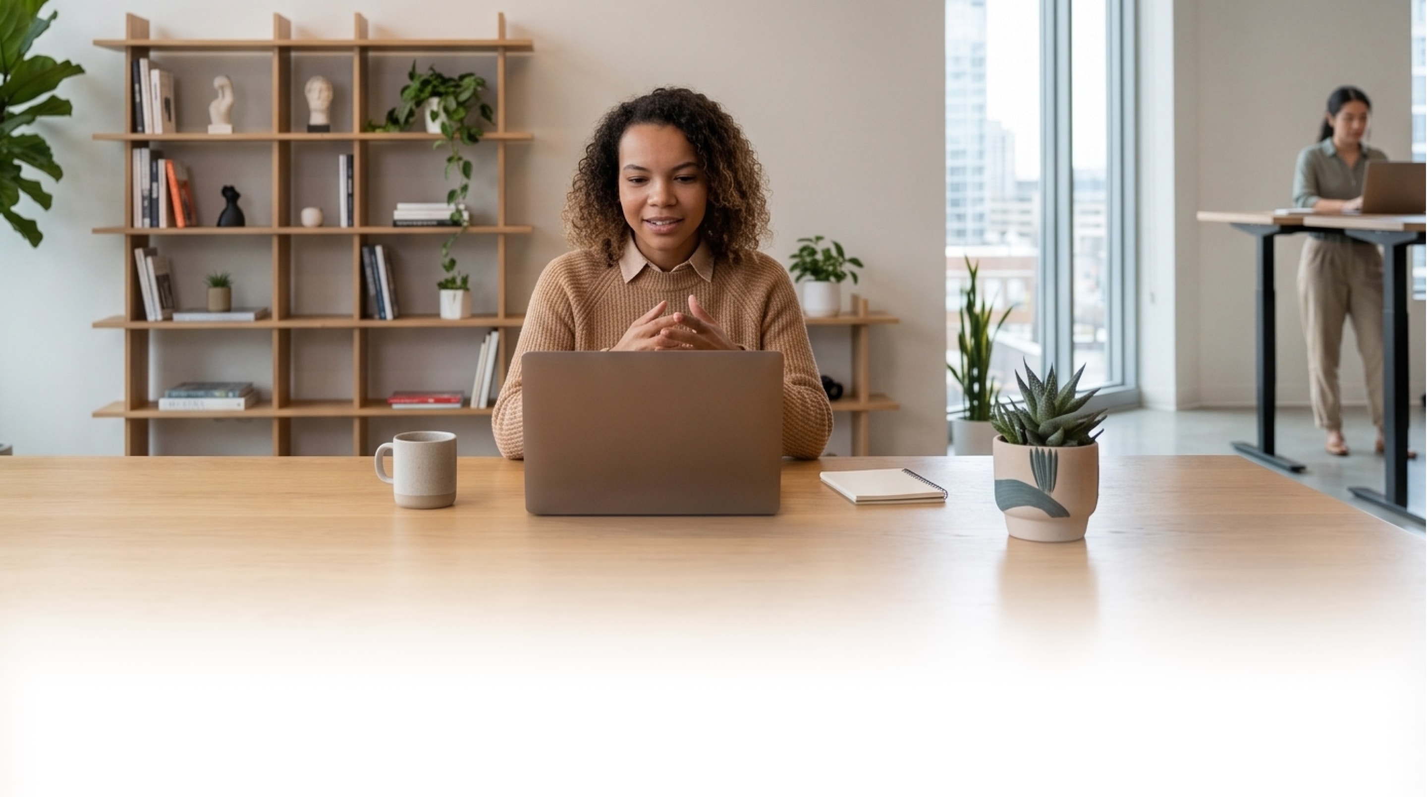 A manager talking with someone on a video call